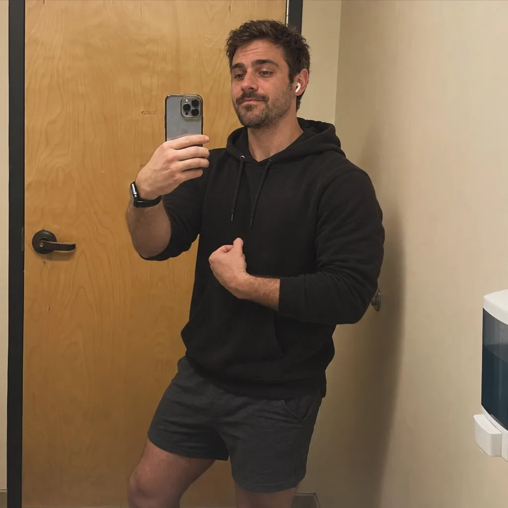 Chris's mirror selfie in a black hoodie, uploaded to TruShot